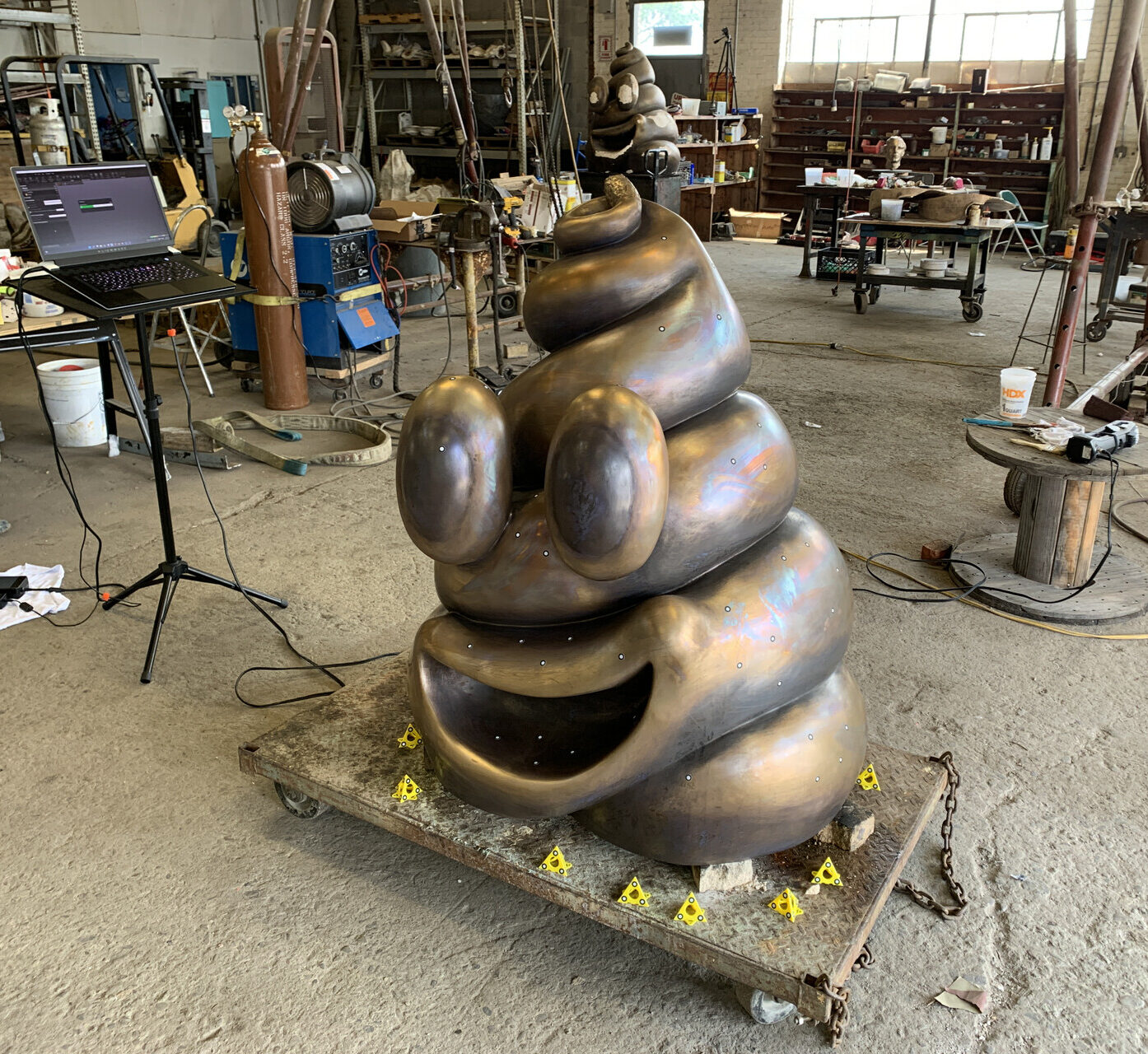 Poop emoji sculpture being 3D scanned